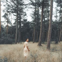 Woman with dog in the forest