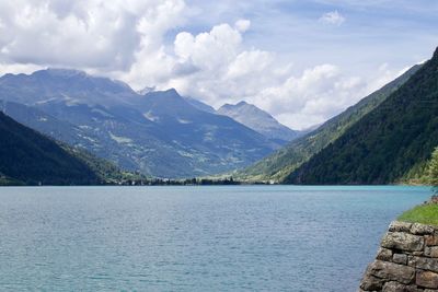 Scenic view of lake and mountains against sky