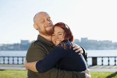 Portrait of young couple embracing