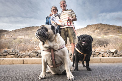 Full length of man standing with dog