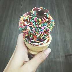Close-up of hand holding dessert