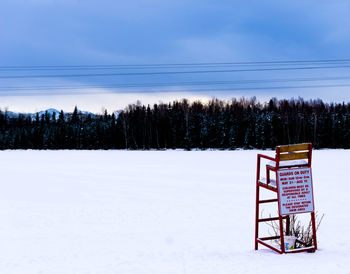 Snow covered field against sky