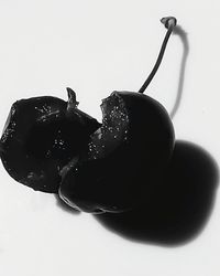 Close-up of cake on table against white background