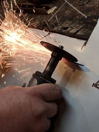 Close-up of hand holding machine