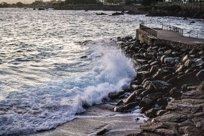 Sea waves splashing on rocks