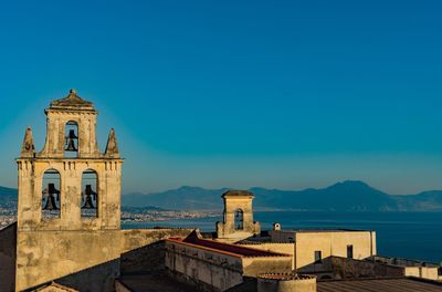 View of bell tower against blue sky