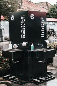 Close-up of telephone booth on table in yard