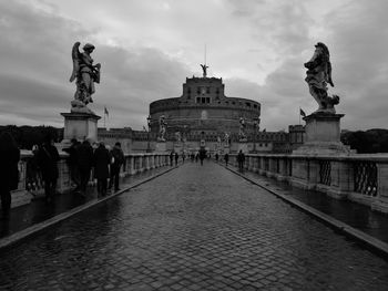 View of fountain in city against sky