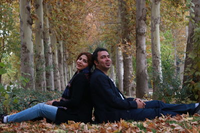 Portrait of couple sitting at park