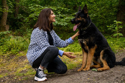 Side view of woman with dog