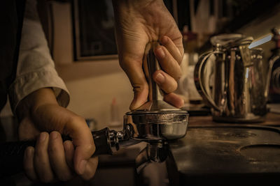 Midsection of man preparing food at home