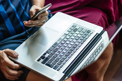 Close-up of a using his laptop in the quarantine period