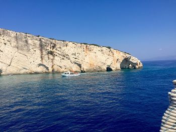 Scenic view of sea against clear blue sky