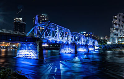  blue bridge of downtown grand rapids glows vibrant after dark