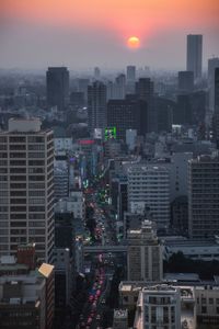 High angle view of buildings against sky during sunset