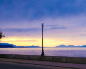 Scenic view of landscape against sky at sunset