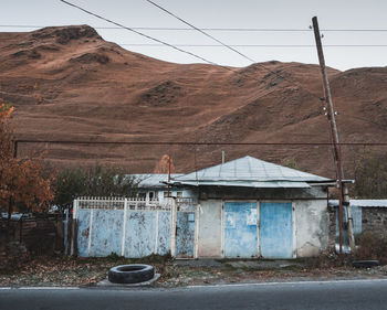 Cars on road against mountain range