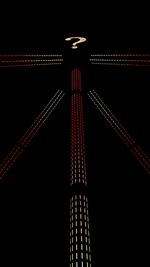 Low angle view of illuminated tower at night