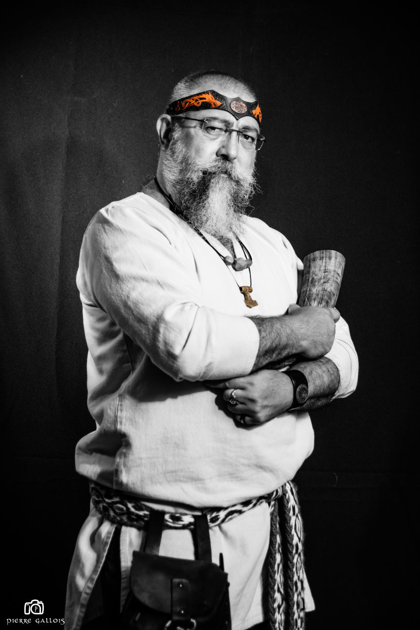 beard, three quarter length, standing, real people, one person, night, holding, mature men, lifestyles, black background, bad habit, studio shot, risk, portrait, axe, outdoors