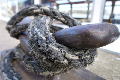 Close-up of rope tied up on metal