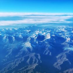 Snowcapped mountains from aircraft cockpit 