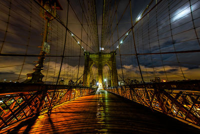 Illuminated bridge against sky