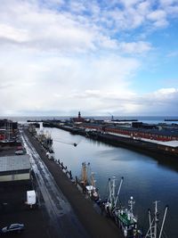 High angle view of bridge over river in city against sky