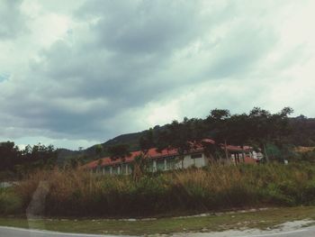 Scenic view of landscape against cloudy sky