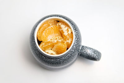 High angle view of coffee on table against white background