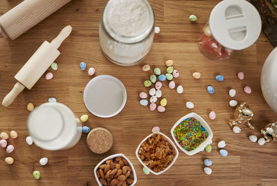 High angle view of eggs with container on table