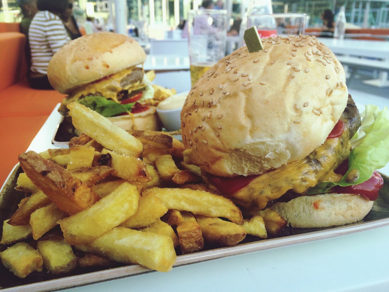 food, food and drink, freshness, ready-to-eat, indoors, unhealthy eating, still life, close-up, plate, focus on foreground, meat, incidental people, indulgence, burger, fast food, french fries, meal, snack, serving size