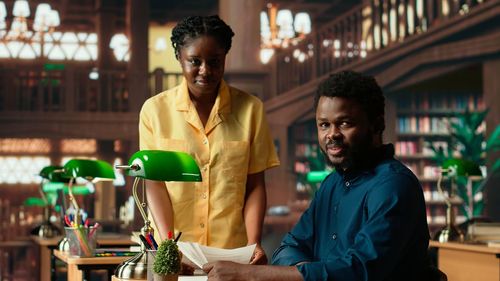 Side view of young man drinking wine