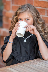 Portrait of a girl drinking coffee