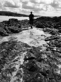 Silhouette of woman standing on beach