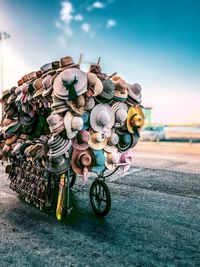 View of hats on bicycle against sky