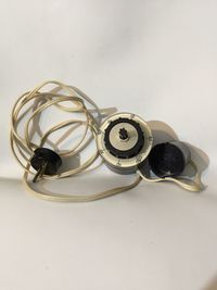 High angle view of camera on table against white background