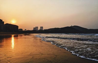 View of beach at sunset