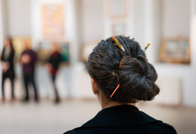 Rear view of woman with hair bun