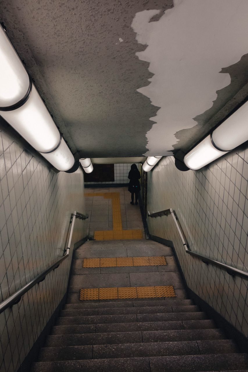 the way forward, direction, staircase, illuminated, steps and staircases, architecture, indoors, railing, public transportation, transportation, subway, wall - building feature, lighting equipment, empty, tunnel, ceiling, built structure, absence, subway station, wall, diminishing perspective, underground walkway, flooring, no people, fluorescent light, underpass, light