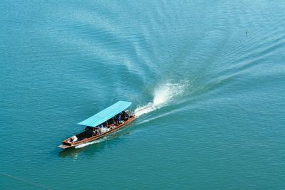 High angle view of boat sailing in sea