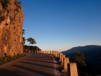 Scenic view of mountains against clear blue sky