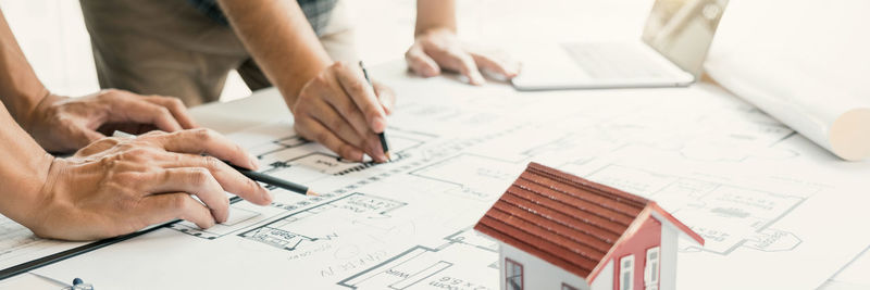 Low angle view of people working at table