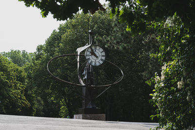 Low angle view of basketball hoop against trees