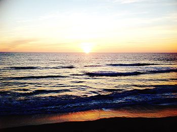 Scenic view of sea at sunset