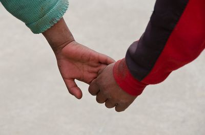 Close-up of couple holding hands