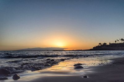 Scenic view of sea at sunset