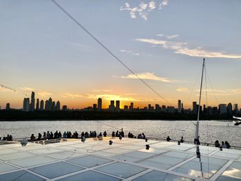 Scenic view of silhouette buildings against sky during sunset