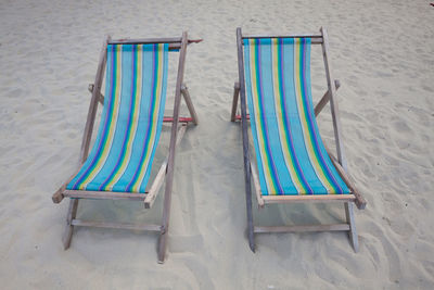 High angle view of chairs on beach