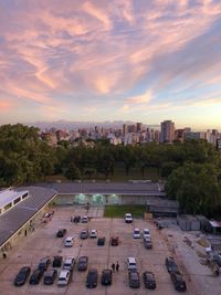 High angle view of buildings in city against sky during sunset