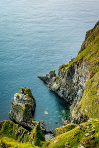 High angle view of rock formations by sea